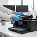 HP W2110X black toner cartridge being installed in HP Color LaserJet Pro printer